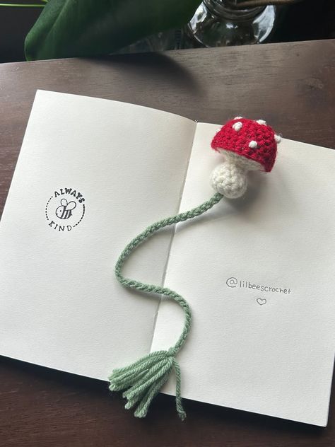 Crochet Bookmark!  Decorate your favorite books with this cute bookmark! These bookmarks will fit most books. The mushroom is 2 inches tall and the chain is roughly 9 inches long *not including tassel* and can stretch an extra inch or two to fit larger books if needed!  Thank you! Mushroom Crochet Projects, Cute Crochet Bookmarks, Crochet Mushroom Bookmark, Crochet Buntings, Crocheted Bookmarks, Mushroom Bookmark, Crochet Bookmarks Free Patterns, Bookmark Crochet, Crochet Bunting