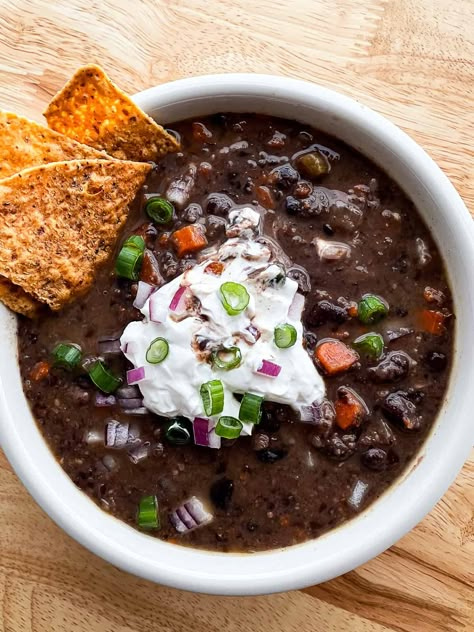 This simple black bean soup recipe uses canned black beans–making for a quick prep since you don’t need to soak the beans. The soup is flavorful and you can adjust the heat-level to suit your tastes. Slow cooker variation included. There’s a lot to love about this soup. I’ve been making the recipe for almost...Read More Black Bean Soup With Bacon, Black Bean Soup Recipe Using Canned Beans, Quick Black Bean Soup, Ham Black Bean Soup, Soup Black Bean, Simple Black Bean Soup, Ham And Black Bean Soup Recipes, Black Bean And Sausage Soup, Beef And Black Bean Soup