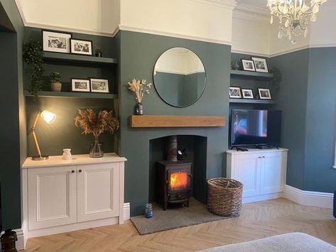 Living Room Designs With Alcoves, Living Room Decor Terraced House, Calm Front Room Ideas, Living Room Ideas With Alcoves, Dark Living Rooms Cozy Accent Wall, Green Lounge Ideas Living Rooms, 1930s Style Living Room, Sitting Room With Log Burner, Green Feature Fireplace Wall