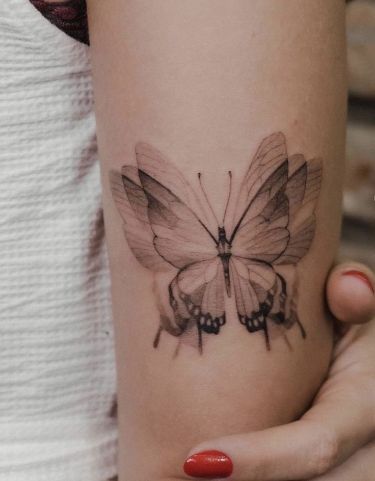 Fluttering Illusions: Mesmerizing 3D Butterfly Tattoo Designs for Inked Elegance Check more at https://ideatatto.com/drawings/fluttering-illusions-mesmerizing-3d-butterfly-tattoo-designs-for-inked-elegance/ 3d Butterfly Tattoo Designs, Geometric Tattoo Butterfly, Butterfly Wing Tattoo, Detailed Tattoos, 3d Butterfly Tattoo, Back Of Arm Tattoo, Wing Tattoo, Popular Characters, Butterfly Tattoo Designs