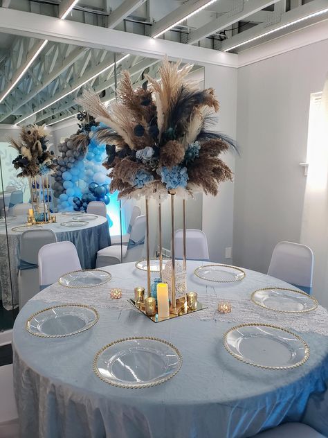 "2 Tall Gold Base Pampas Centerpiece Arrangements rising about 43\" tall from an 8\"base with Blue Florals 1 Wall/Backdrop Mounted Pampas Floral Arrangements measuring about 6' across and 4.5' tall at a depth of 1' 6 Medium Light Blue & White Floral Arrangements 3 Medium Dark Blue Variation Floral Arrangements 18 Bud Vase Arrangements with Blue Florals in Boho Glass Bottle Containers" Dusty Blue Floral Arrangements, Floral Arrangements With Pampas, Pampas Centerpieces, Arrangements With Pampas, Blue Floral Arrangements, Blue Flower Centerpieces, Royal Blue Centerpieces, Bud Vases Arrangements, Grass Centerpiece