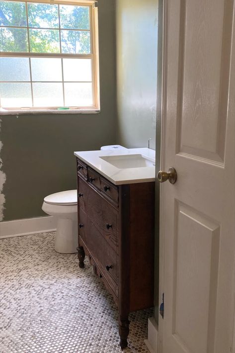 Bathroom remodel with conversion of vintage dresser into a bathroom vanity. White penny tile floors with moody green walls. Bathroom Vanity Renovation, Antique Bathroom Cabinet, Bathroom Vanity Antique, Vanity Antique, Dresser Vanity Bathroom, Vintage Bathroom Vanity, Antique Bathroom Vanity, Dresser Diy, Functional Bathroom