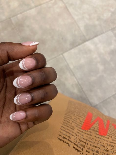 Almond french tip nails on a dark skin woman with an extra white line follow the same curvature as the tip Double French Nails Short, French Tip With Extra Line, Simple Bridesmaid Nail Ideas, White Double French Tip Nails, Pink Double French Tip Nails, Fun White French Tip Nails, Summer French Manicure Ideas, L French Tip Nails, White Formal Nails