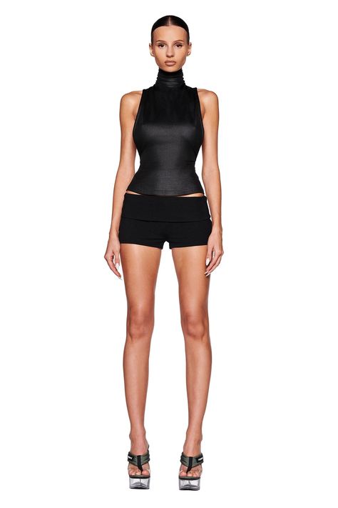 Black top in a stretch faux leather fabrication Full-length and bodycon silhouette Features a high neck collar with invisible zipper closure at center back Low cut armhole Fully Lined - This fabric is not sheer We recommend wearing no bra or pasties with this garment Size and Fit True to size. We recommend wearing your standard size Bodycon fit - Designed to hug your body Our full length top- Designed to sit approximately at wearers hips Front bust width: XXS: 26.1CM, XS: 27.3CM, S: 28.5CM, M: 3 I Am Gia Outfits, High Neck Collar, Black Two Piece, Outfit 90s, I Am Gia, Simple Fits, Shop Tops, Romper Pants, Comfy Fits