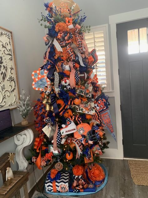 Orange and blue Auburn University Christmas Tree Auburn Christmas Tree, Christmas Tree Color Schemes 2024, Orange And Blue Christmas Tree, Blue And Orange Christmas Tree, Orange Christmas Tree, Christmas Tree Colour Scheme, Orange Christmas, Blue Christmas Tree, Blue Tree