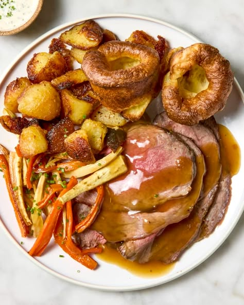 English Sunday Roast Recipe | The Kitchn English Roast, Roast Dinner Recipes, Carrots And Parsnips, Sunday Roast Dinner, Roasted Carrots And Parsnips, Creamy Horseradish, Creamy Horseradish Sauce, Roasted Beef, Sliced Roast Beef