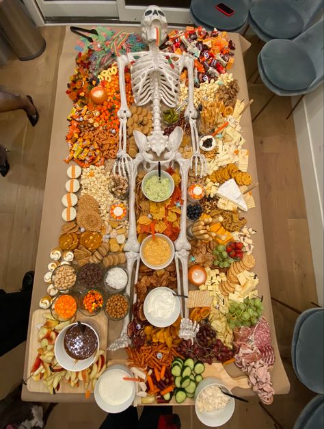 Halloween grazing table with life-size skeleton charcuterie Trader Joe’s Halloween Grazing Table, Halloween Charcuterie Board Ideas, Halloween Bunco, Pumpkin Shaped Cookies, Retro Living Room Decor, Life Size Skeleton, Profitable Woodworking Projects, Halloween Charcuterie Board, Halloween Charcuterie