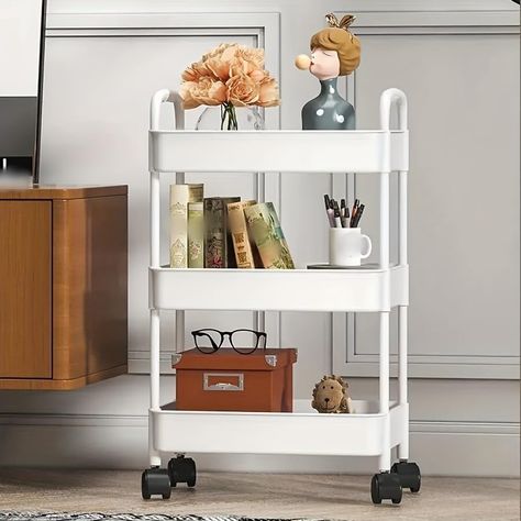 PRICES MAY VARY. Storage Cart : Keep supplies and essentials neatly stored and easily visualize and access storage. Suitable for closets, kitchens, bathrooms, garages, laundry rooms, offices. Easy To Move : There are four wheels that can rotate 360 degrees,and two of them are lockable,and you can slide them at will. Even if it's heavy, you can easily move it. Convenient for your storage. Light material : Made of sturdy plastic, which can be used by you for a long time. The storage box is made of Storage Cart On Wheels, Rolling Cart Storage, Shelf For Kitchen, Cart On Wheels, Organization Cart, Rolling Storage Cart, Storage Trolley, Bookshelf Storage, Bathroom Storage Racks