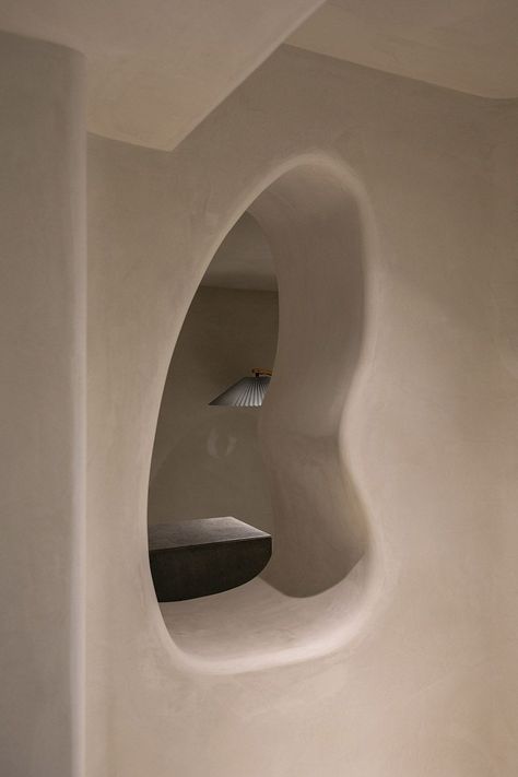 Read the Living In Design journal to explore more about this cave inspired space design. Cave Interior, Interior Design Spaces, Concrete Effect Paint, 70s Interior, Interior Design Contemporary, Indirect Lighting, Floor Colors, Single Person, Photoshop Design