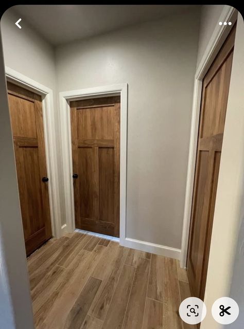 White Door Frame Wood Door, Stained Trim And Doors Interior Design, Scandinavian Trim Interior, Tan Walls Wood Trim, Brown Bedroom Doors, Dark Brown Doors With White Trim, White Trim Brown Windows, Wood Stained Doors Interior, Baseboard And Door Trim Color Ideas