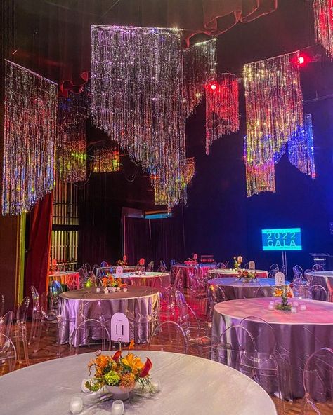 Drag Show Decorations, 2023 Backdrop Trends, Prom Wedding Theme, Neon Light Centerpieces, Disco Ceiling Decor, Disco Theme Gala, Pop Culture Decor, Fringe Ceiling Decor, Disco Centerpieces