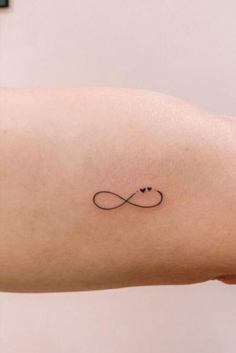 23 Small Tattoos For Women That Are Meaningful & Stylish Infinity Tattoo Unique, Simple Infinity Tattoo Designs, Tiny Matching Tattoos Sisters Meaningful, Small Fun Tattoos For Women, Small Matching Tattoos Sisters, Unique Sibling Tattoos For 3, Mini Tattoos Sisters, Tiny Tats With Meaning, Tattoo Designs Infinity