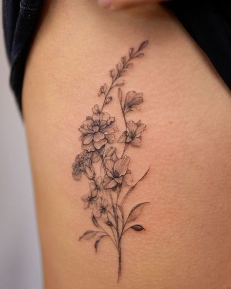 Montreal fineline SoSo on Instagram: "Birth month family bouquet for Maggie 🥰 marigold, carnation, larkspur and gladiolus flower 🌹   Note 📝  Tattoo on the ribs can hurt !  . . . . #flowerbouquettattoos #finelinebouquettattoos #montrealflorist #marigoldtattoo #larkspurtattoo #gladiolustattoodesign #carnationtattoo #metrixtattooneedles" Marigold Tattoo Ribs, Carnation Daisy Marigold Tattoo, Carnation Larkspur Tattoo, Larkspur And Marigold Tattoo, Narcissus And Gladiolus Flower Tattoo, Marigold Vine Tattoo, Marigold Tattoos For Women, October And April Birth Flower Tattoo, Fineline Birth Flower Tattoo