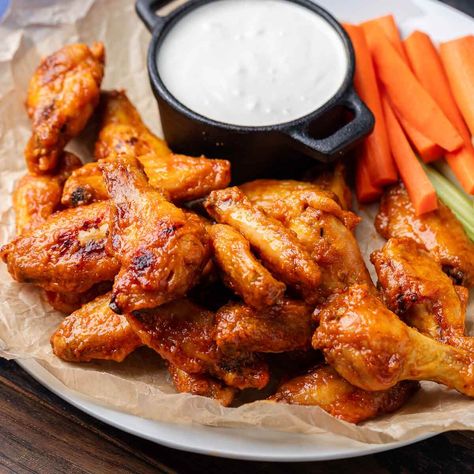 Buffalo Wings are everyone's favorite game-day appetizer! Saucy, crispy, and oven-baked, these are easy to make and easy to eat! Oven Baked Buffalo Wings, Best Buffalo Wings, Wings At Home, Wing Sauces, Baked Buffalo Wings, Sip And Feast, Feast Recipes, Cayenne Pepper Sauce, Wings Recipe Buffalo