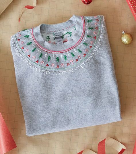 How To Make Holiday Embroidered Sweatshirt Online | JOANN Sweatshirt Embellishment Ideas, Embroider Shirt Diy, Christmas Sweatshirt Embroidery, Hand Embroidered Sweatshirt Ideas, Fall Embroidery Designs Sweatshirt, Christmas Embroidery Sweater, Embroidered Tshirt Ideas, Hand Embroidery Sweatshirt Ideas, Christmas Embroidered Sweatshirt