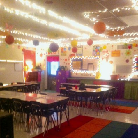 Classroom decorating ideas. I like lots of lights and lamps in my classroom rather than always using those harsh florescent lights. Also it is good to have the extra light when using the promethean board so I can see the students and they have enough light to be able to work. I use gem clips to hang Christmas lights around the ceiling and also put them around bulletin boards. Lamps are placed throughout the room. It's cozy and the kids love it. Christmas Lights In Classroom, Christmas Lights Classroom, Lights In Classroom, Classroom Lights, Lights Classroom, Classroom Lighting, Dance Classroom, Classroom Ceiling, Promethean Board