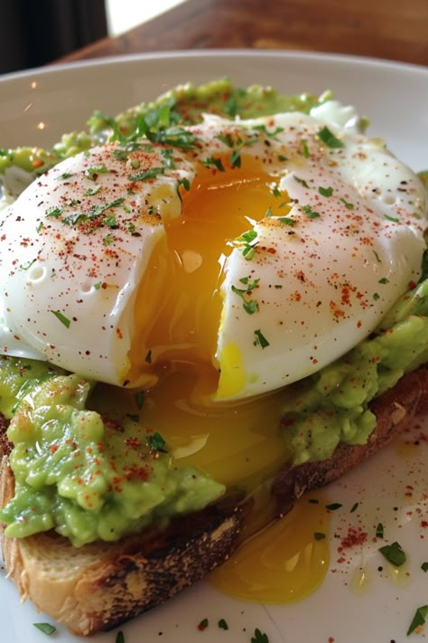 "Elevate your breakfast game with Avocado Toast and Poached Egg! 🥑🍳 A combination that’s as tasty as it is Instagram-worthy. 🌿✨ #BrunchInspiration #AvocadoToastInspo #PerfectBreakfast"