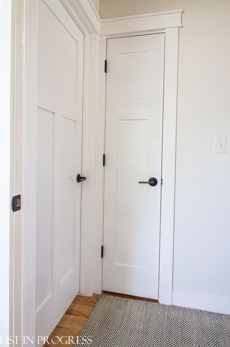 12 Modern Black Door Hardware Ideas - List in Progress White Wall White Trim, Interior Doors With Black Hardware, Behr Cottage White, White Interior Doors With Black Hardware, Doors With Black Hardware, Behr White Paint Colors, Craftsman Style Door Trim, Craftsman Door Trim, Modern White Interior