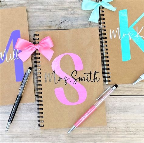 "Teacher Gifts, Teacher Christmas Gift, Teacher Note Pad, Teacher Notebook, Teacher Personalized Gifts, Gift for Teacher, Teacher Christmas These adorable personalized notebook and pens are the perfect gift for every teacher!  These notebooks are personalized with an initial in the color of your choice with the name in white or black font and finished off with a cute matching bow.   You can choose to purchase just the notebook or notebook & pen.  We love cute pens and these are our most favorite ever!  These are glitter pens with a stylus top and each is engraved with different teacher appreciation quotes (Love, Inspire Teach, Best teacher Ever etc).  Teachers will LOVE these pens!  NOTEBOOK SPECIFICS:  ❤ These soft covered notebooks measure 5x8.3 inches and have 50 unlined sheets (100 pag Teacher Personalized Gifts, Monogram Teacher Gifts, Handmade Teacher Gifts, Appreciation Gifts Diy, Teacher Notepad, Teacher Gift Baskets, Teacher Appreciation Gifts Diy, Teacher Christmas Gift, Cute Teacher Gifts