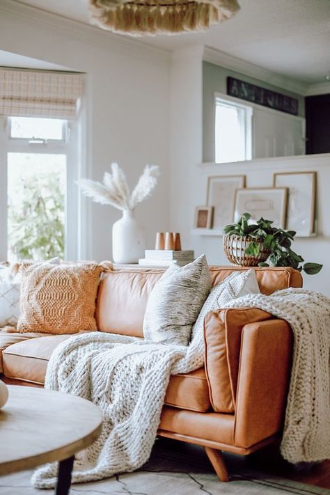 a comfy amber leather sofa styled with knit and crochet pillows and blankets is very cozy and inviting Article Sofa, Tan Leather Sofas, Leather Couches Living Room, Navy Living Rooms, Leather Corner Sofa, Living Room Scandinavian, Neutral Living Room, Leather Couch, Sofa Styling