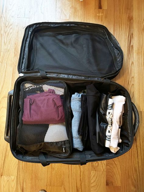 Suitcase on floor packed with rolled clothes and mesh bag Travel Baggage, Suitcase Packing Tips, Shopping Pictures, Packing Bags Travel, Cool Galaxy Wallpapers, Carry On Packing, Checked Baggage, Packing Clothes, Konmari Method