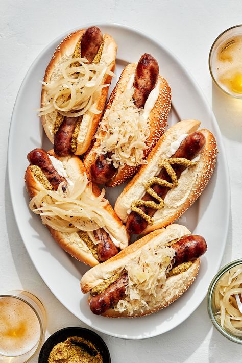 Simple, delicious brats take on subtle notes of beer and then are charred on the grill. Up your ballpark hotdog game for these homestyle beer brats. Brats Recipes Grilling, Beer Brats Recipe, November Recipes, Recipes For Grilling, Beer Bratwurst, Brats Recipes, Fried Hot Dogs, Homemade Pickles Dill, Sour Cabbage