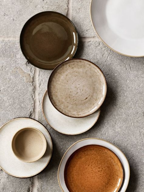 The newest evolution of our coveted Marin dinnerware crafts the collection's signature organic curves with Ecogresr-stoneware made of 90% recycled clay. The dinner plate showcases a subtly shiny white glaze that's unique to each piece and allows for peeks of the natural earthy clay to show through. Hand-finished by highly skilled artisans in Portugal to make each one unique, the freeform-rim plate stands up to everyday use and dishwasher cleaning. It's artisanal dinnerware designed to be lived w Black Stoneware Table Setting, Moody Place Setting, Table Wear Set, Plates And Dishes, Dish Ware Sets, Dinner Party Serveware, Everyday Plates Dinnerware Sets, Restaurant Plates Design, Scandinavian Dishes Set