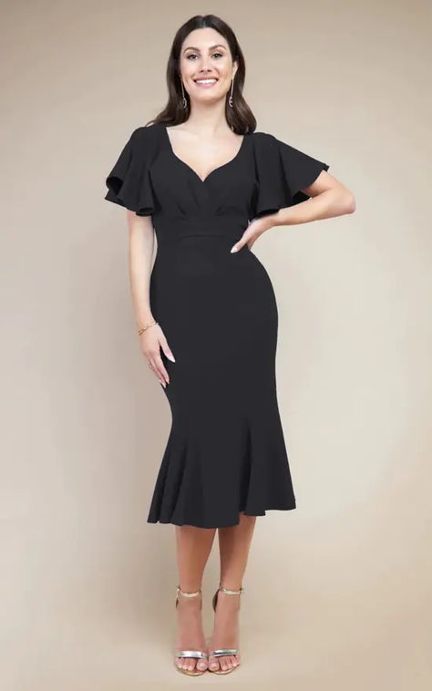 This stunning Scuba Midi dress features a wrap style design with short sleeves, making it the perfect choice for any semi-formal occasion. Its classic yet timeless style is sure to turn heads, making it a great option for wedding guests. With a midi length hemline, this black dress strikes the perfect balance between elegance and practicality. Its flattering silhouette and versatile design make it a wardrobe staple for any fashion-conscious individual looking to make a statement. Whether you're dressing up for a special occasion or simply looking for a stylish and comfortable outfit, this black wrap style Scuba Midi dress is a must-have. Emerald Green Dress, Emerald Green Dresses, Jumpsuit Elegant, Wrap Midi Dress, Night Out Outfit, Versatile Outfits, Green Midi Dress, Wedding Guests, Black Midi Dress