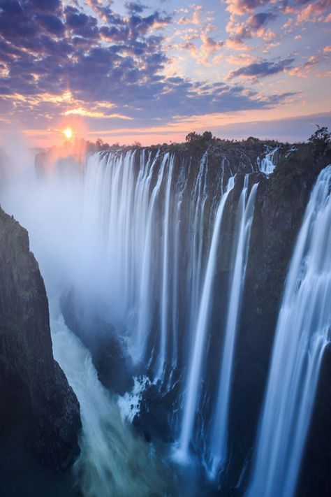 Experience the awe-inspiring Victoria Falls, one of the world's largest waterfalls, located in Zambia, Africa. A UNESCO World Heritage Site and a popular destination for adventure seekers and nature lovers. Lake Victoria Africa, Victoria Falls Aesthetic, Zambia Aesthetic, Victoria Falls Zambia, Zambia Africa, Largest Waterfall, Victoria Falls, Kitenge, Beautiful Waterfalls