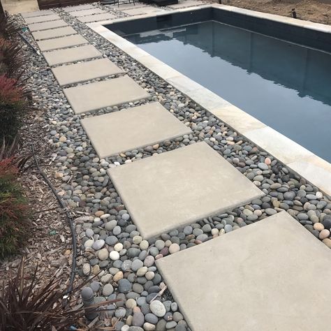 Turf And Stepping Stones, Pool Rocks Landscaping, Stone Pavers Around Pool, Pavers Around Pool Landscape Design, Pool Border Landscaping, Pavers Around Pool Ideas, Rocks Around Pool Landscape Design, Gray Landscaping Rock, Pebbles Around Pool