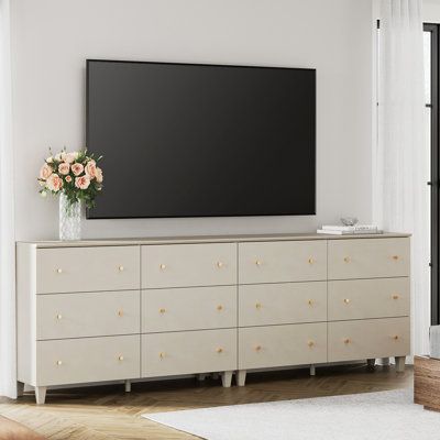 This 12-drawer TV dresser goes well with your bedroom, living room, or anywhere needs to be organized and stored. Each cabinet is equipped with an anti-tip kit which makes it perfect for households with children. Color: Beige | Wade Logan® Bonis TV Stand for TVs up to 88" Wood in Brown | 32.4 H x 94.4 W x 15.3 D in | Wayfair Bedroom Dresser Under Tv Decor, Tv Above Dresser Bedroom, Large Dresser Bedroom, Tv On Wall Ideas Bedroom, Dresser Under Tv, Under Tv Decor, Tv Stand Dresser, Tv Dresser, Shelves Around Tv