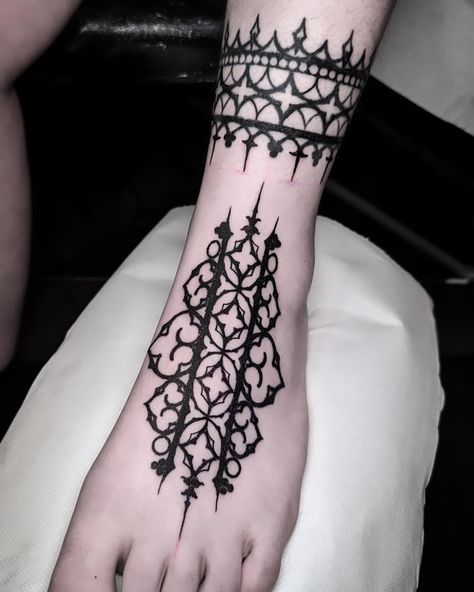 Foot tattoo and old ankle ring gothic geometric Encore merci !! NEXT GUESTS +PARIS +BERLIN +VIENNA Done with @probodysupply @pepax.official #tattoo #tattoos #foottattoo #ink #inked #ornamentaltattoo #occult #ornaments #ornamental #blackworktattoo #blackworkerssubmission #blackwork #blackworkers #blackart #blacktattooart #skulltattoo #architecturaltattoo #artwork #art #dotworkers #dotworktattoo #geometry #geometrictattoo #goth #gothic Gothic Pattern Tattoo, Gothic Ornamental Tattoo, Back Tattoo Ornamental, Gothic Arm Tattoo, Gothic Ornament Tattoo, Ornamental Blackwork Tattoo, Gothic Henna, Gothic Tattoos, Gothic Pattern