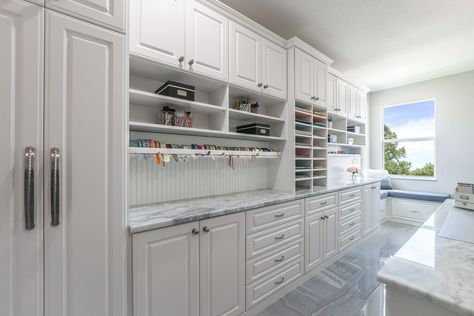 This large crafting room features a wrapping station with organizers for ribbons and supplies. Custom Craft Room, Basement Craft Rooms, Scrapbook Rooms, Closet Factory, Wrapping Station, Craft Room Furniture, Sewing Room Design, Dream Craft Room, Craft Room Design