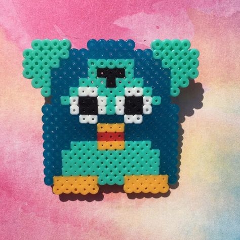 Cute Furby pin made out of mini perler beads!! Pin glued on using e6000. Mini Perler Beads, Perler Bead Designs, Melt Beads, Melt Beads Patterns, Hamma Beads Ideas, Easy Perler Bead Patterns, Pearl Beads Pattern, Easy Perler Beads Ideas, 3d Perler Bead