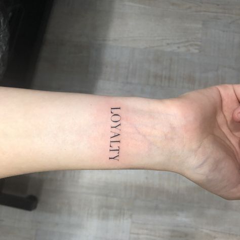 Loyalty Wrist Tattoo, Vertical Word Tattoo Lettering, Loyalty Tattoo For Men, Loyalty Tattoo For Women Ideas, Grunge Tats, Loyalty Tattoo Designs, Tatto Man, Love Wrist Tattoo, Latin Tattoo