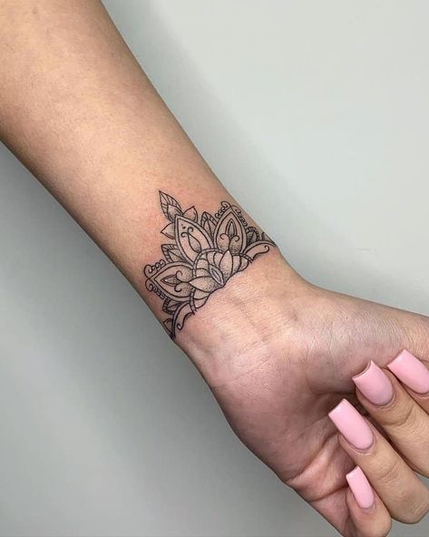 20 Sweet Wrist Tattoos For Women To Enhance Your Femininity 1 Tatoos Woman Hand Mandala, Forearm Henna Tattoo Women, Half Cuff Tattoo, Mandala Wrist Tattoos For Women Cover Up, Mandela Tattoo Wrist, Mandala Flower Wrist Tattoo, Geometric Wrist Tattoos For Women, Mandala Tattoo Women Arm, Half Mandala Wrist Tattoo