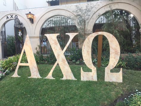 Alpha Chi Omega giant lawn letters sorority recruitment marble UCLA Alpha Psi ΑΧΩ Alpha Chi Omega Aesthetic, Sorority Lawn Letters, Sorority Backdrop, Recruitment Decorations, Sisterhood Round, Art Catalogue, Letters Sorority, Polar Plunge, Spring Recruitment