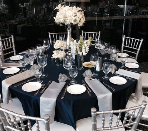 Wedding Reception Guest Table, Flower Centerpieces, Navy Blue, Silver, White Silver Wedding Reception Decor, Navy And Gold Decor, Gold Decor Ideas, Silver Wedding Reception, Navy Blue Wedding Theme, Silver Wedding Theme, Blue Silver Weddings, Quince Stuff, Blue Table Settings