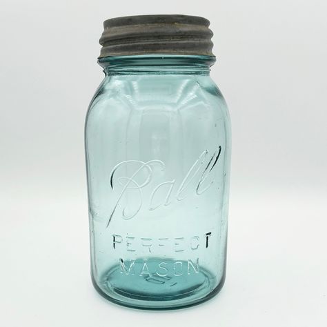 "What makes this quart-sized Ball PERFECT MASON jar rare is that it should not exist! The 'Ball Blue' PERFECT series ended in 1922, and the logo on this jar was only used from 1923 to 1933. (Notice there's no underscore.) This jar was one of the last in the PERFECT series but one of the first with the 'new' logo.  The color of this quart-sized Perfect Mason Ball jar is commonly referred to as \"Ball Blue\", a color that came from sand used to make glass taken from the Hoosier Slide sand dune on Antique Crocks Decor Ideas, Antique Dishes Collectible, Vintage Dishes Antiques, Fruit Jars, Milk Glass Decor, Vintage Glassware Antiques, Old Glass Bottles, Ball Jar, Glass Art Pictures