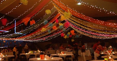 In the blog post " Draped ceiling transforms gym from drab to dramatic ", brightly colored  poly deco mesh  and twinkling white lights ... School Dance Decorations, Mesh Ceiling, School Dance Ideas, Middle School Dance, 8th Grade Dance, Dance Decorations, Dance Themes, School Gym, Homecoming Dance