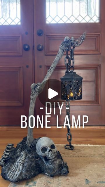 Mary Beth Wilhelm on Instagram: "DIY SKELETON BONE LAMP POST??? 🤣 🖤 ☠️ 🦴🔥 
Most materials used are from The Dollar Store!!! The loctite ($6.96) and spray paint ($5.98) were the most expensive materials for me. I had the styrofoam, paint and the bones. And again, Dollar stores and Walmart carry them if needed. 

Materials:

Plastic LIGHTWEIGHT skeleton bones. 
Lantern 
Chain 
Loctite
A box or styrofoam for your base
Black spray paint 
Black acrylic paint" Bones Halloween Decor, Spray Paint Skeleton, Dollar Store Skeleton Ideas, Diy Bone Decor, Halloween Styrofoam Crafts, Diy Skeleton Lamp, Halloween Chains Decor, Diy Bones Halloween, Halloween Prop Diy