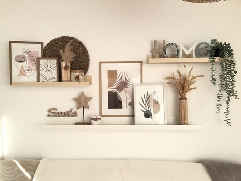 28 Best Wall Decor Ideas To Decorate Your Blank Wall - Foyr Welcome Home Wall Decor, Picture Shelf Aesthetic, Walls With Shelves Living Room, Three Shelves Above Couch, Floating Shelves Living Room Over Couch, Floating Shelves With Frames, Decoration Wall Living Room, Three Shelves On Wall, Lounge Wall Shelf Ideas