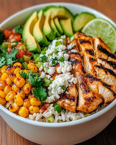 Learn how to make this easy Street Corn Chicken Rice Bowl with grilled chicken, cilantro-lime rice, and creamy street corn. A perfect meal Chicken Rice Bowl Sauce, Chicken Mexican Street Corn Bowl, Mexican Street Corn Chicken And Rice Bowl, Mexican Street Corn Chicken Bowl, Street Corn Chicken Rice Bowl Recipe, Rice Bowl Ideas Chicken, Chicken Elote Bowl, Easy Dinner Bowl Recipes, Chicken Street Corn Bowl