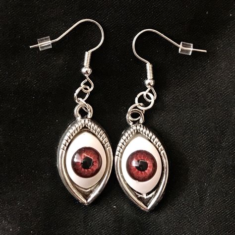 "This is a pair of silver earrings with eerily realistic brown glass eyeballs, that seem to always be looking at you. They are a really fun and a little spooky! Hung on fish hook ear wires, they are 2\" long, and just over 1/2\" wide. Make sure to check out my shop for more hair pins, jewelry, earrings, accessories, and all sorts of fun stuff!" Strange Earrings, Creepy Accessories, Eyeball Jewelry, Spooky Accessories, Eyes Creepy, Spooky Jewelry, Eyeball Earrings, Creepy Earrings, Eye Accessories