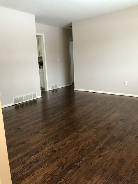 Behr moth gray paint + medium brown stain on oak floors @revisionedhome Moth Grey Paint Behr, Brown Interior Paint Wall Colours, Moth Gray Paint, Behr Moth Gray, Brown Flooring Living Room, Brown Interior Paint, Brown Grey Paint Color, Stain On Oak, Dark Brown Wood Floors