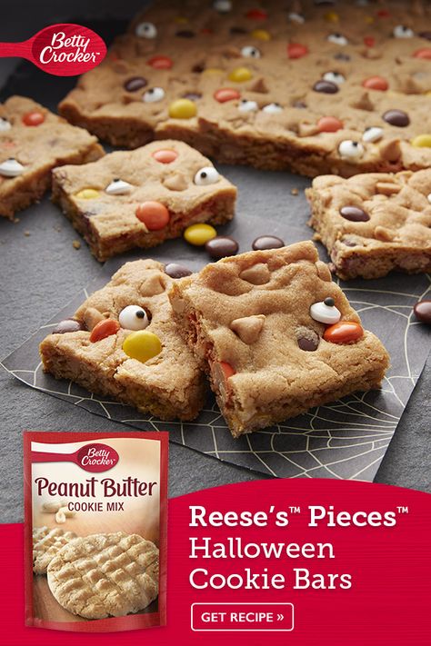 Celebrate halloween with these REESE'S PIECES™ Halloween Cookie Bars that boast Betty Crocker™ peanut butter cookie mix, REESE'S PIECES™ Peanut Butter Chips and candies. Your little ghosts and goblins will gobble up this easy dessert and have fun baking them! It's the perfect bar for your Halloween party! Halloween Cookie Bars, Betty Crocker Peanut Butter Cookies, Reese's Cookies, Peanut Butter Cookie Bars, Ghosts And Goblins, Reese's Pieces, Candy Eyeballs, Easy Peanut Butter Cookies, Hallowen Ideas