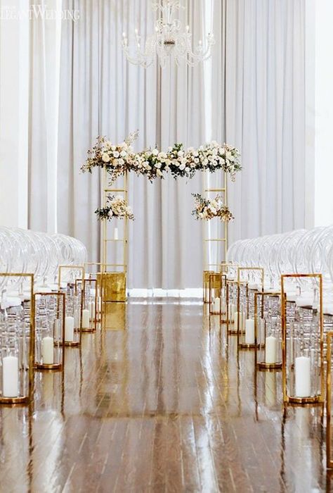 White And Gold Wedding Ceremony Aisle Decorations, Modern Indoor Wedding Ceremony, Modern Wedding Aisle Decor, Small Wedding Ceremony Indoor, Modern Ceremony Decor, Ceremony Aisle Decor Indoor, White And Gold Wedding Ceremony, Gold Wedding Aisle, Wedding Ceremony Arch Indoor