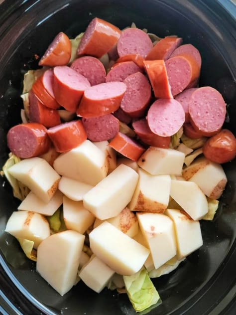 This recipe for Slow Cooker Kielbasa with Cabbage and Potatoes is hearty and delicious. Cabbage, kielbasa, and chunks of potatoes cooked low and slow in broth until everything is tender and flavorful Cabbage And Sausage In Crockpot, Slow Cooker Cabbage And Kielbasa, Polish Sausage Recipes Kielbasa Fried Cabbage, Crockpot Polish Sausage And Cabbage, Kiebalsa Sausage And Cabbage Recipe, Kielbasa And Cabbage Recipes Crockpot, Kielbasa Cabbage Potatoes Crockpot, Slow Cooker Potatoes Cabbage And Kielbasa, Kielbasa And Potatoes And Cabbage