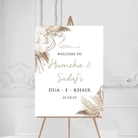 Dried Floral Pampas 'Dua E Khair'  Welcome Sign Personalised entrance welcome sign. Suitable for a frame or can be backed onto foam backing board before being despatched. Please select your size and send over your personalisation- names in order and date. Please do not hesitate to get in touch with any questions or extra personal touches you may require :) GOLD IS GOLD COLOURING ONLY All our prints are printed on high quality matt paper 280gsm A5-A3, 180gsm A2 *Easel, Flowers, Props etc are not included - you are purchasing the print only* POSTER - Professionally printed onto high quality white 260gsm satin poster paper. This is ideal for displaying in a frame or mounting on your own board. Will be sent rolled up in a tube. FOAMBOARD - Print mounted onto a 5mm foamboard, lightweight but st Dua Khair Decoration At Home, Dua E Khair Decoracion, Dua E Khair, Engagement Poster, Boho Wedding Welcome Sign, Shaadi Ideas, Engagement Party Welcome Sign, Baat Pakki, Bride Shoot