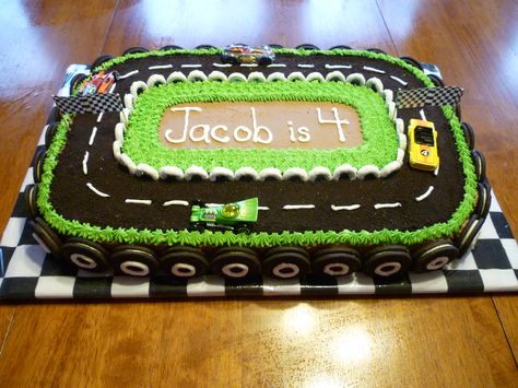 Race Track cake surrounded with Oreo cookie "wheels" and yogurt covered pretzel circles for the inside track.  I covered the board with a checkerboard bandana then covered that with plastic wrap.  The "track" is crushed cookie. Race Cars Cake, Race Track Cake, Racing Cake, Motorcycle Cake, Race Car Cakes, Wheel Cake, Handbag Cakes, Cars Birthday Cake, Cars Cake